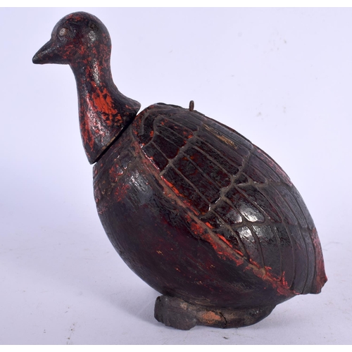 678 - AN UNUSUAL 19TH CENTURY INDIAN PAINTED COCONUT FLASK formed as a bird. 14 cm x 9 cm.