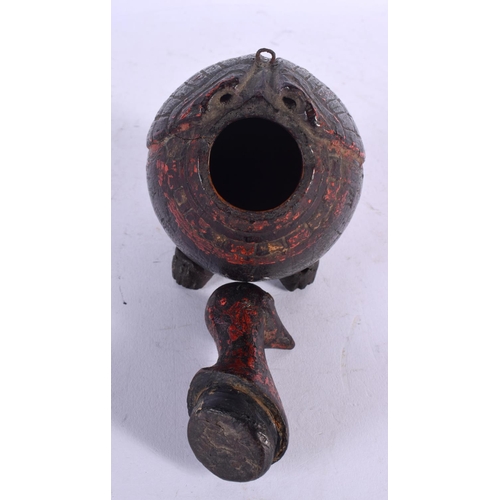 678 - AN UNUSUAL 19TH CENTURY INDIAN PAINTED COCONUT FLASK formed as a bird. 14 cm x 9 cm.