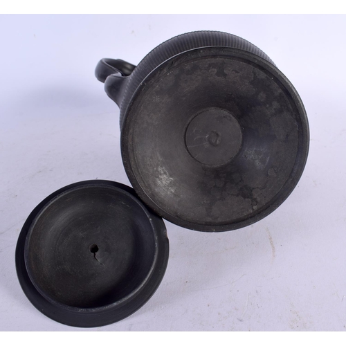 686 - A 19TH CENTURY ENGLISH BLACK BASALT COFFEE POT AND COVER together with an unusual black basalt plaqu... 