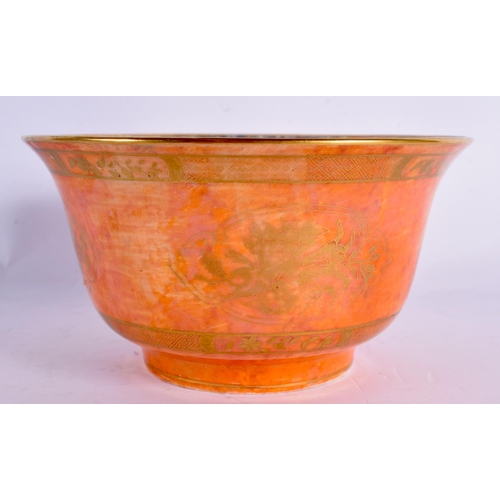 69 - AN ART DECO WEDGWOOD ORANGE PORCELAIN LUSTRE BOWL painted with gilt flowers. 14 cm x 8 cm.