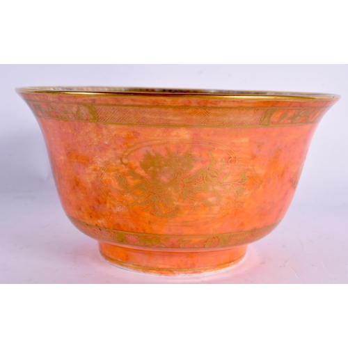 69 - AN ART DECO WEDGWOOD ORANGE PORCELAIN LUSTRE BOWL painted with gilt flowers. 14 cm x 8 cm.