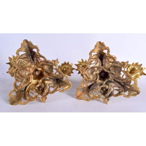 694 - A PAIR OF 19TH CENTURY FRENCH GILT BRONZE AND PORCELAIN COUNTRY HOUSE CANDLESTICKS formed with figur... 