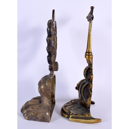 697 - TWO COUNTRY HOUSE BRONZE DOOR STOPS. Largest 27 cm x 9 cm. (2)