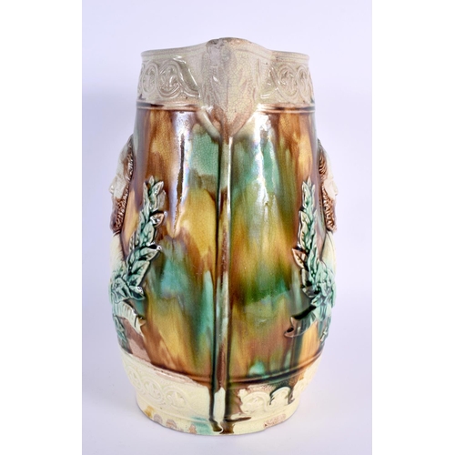 700 - AN UNUSUAL LARGE 19TH CENTURY MAJOLICA POTTERY JUG depicting figures in relief. 26 cm x 17 cm.