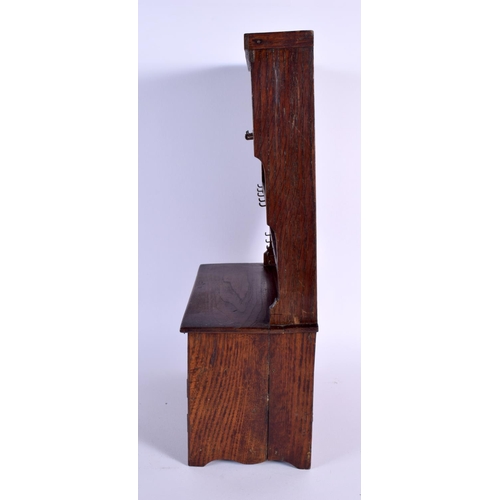 701 - AN EDWARDIAN MINIATURE PINE DRESSER PIPE RACK. 40 cm x 22 cm.