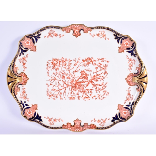 702 - A ROYAL CROWN DERBY IMARI TEASET ON TRAY. Largest 36 cm x 20 cm. (8)