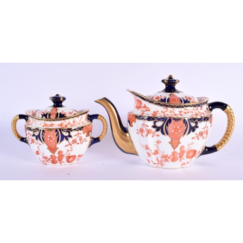 702 - A ROYAL CROWN DERBY IMARI TEASET ON TRAY. Largest 36 cm x 20 cm. (8)