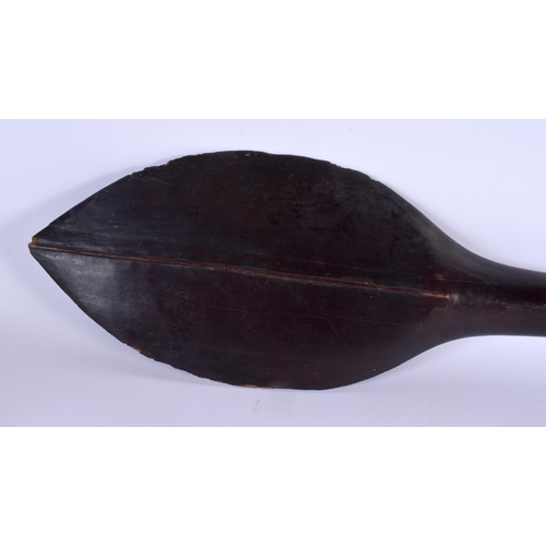 709 - A 19TH CENTURY SOUTHSEA ISLANDS TRIBAL CARVED HARDWOOD PADDLE. 115 cm long.