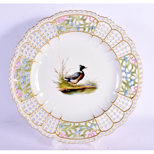 73 - A GERMAN MEISSEN PORCELAIN RETICULATED PLATE painted with a duck within a landscape. 24 cm wide.