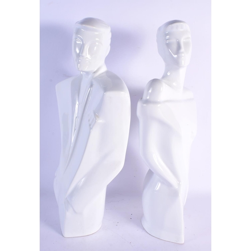 74 - A STYLISH PAIR OF 1980S WHITE GLAZED POTTERY FIGURES modelled in the deco style. 39 cm x 14 cm.