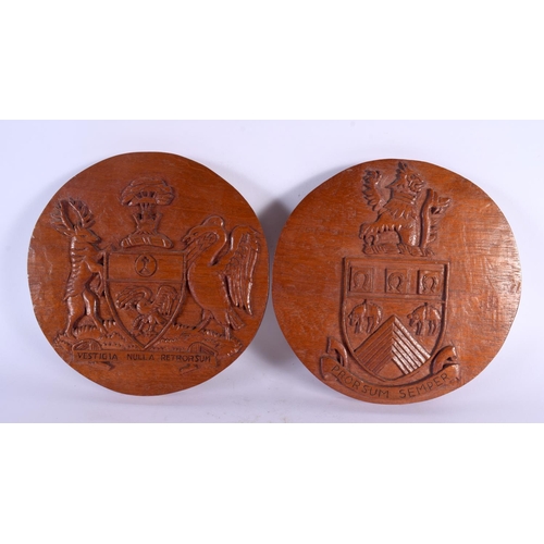 743 - THREE VINTAGE COUNTRY HOUSE CARVED WOOD ARMORIAL PLAQUES. 20 cm diameter. (3)