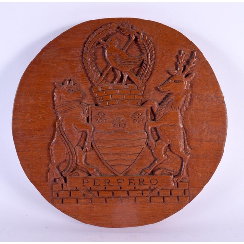 743 - THREE VINTAGE COUNTRY HOUSE CARVED WOOD ARMORIAL PLAQUES. 20 cm diameter. (3)