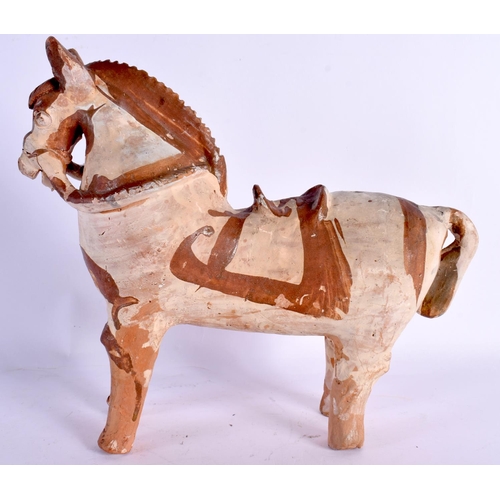 75 - A CONTINENTAL FOLK ART PRIMITIVE POTTERY FIGURE OF A HORSE. 24 cm x 22 cm.