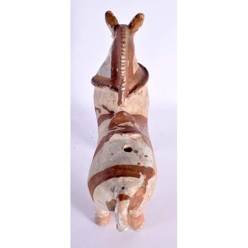 75 - A CONTINENTAL FOLK ART PRIMITIVE POTTERY FIGURE OF A HORSE. 24 cm x 22 cm.