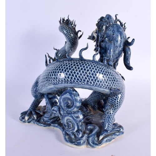 752 - A RARE 17TH/18TH CENTURY CHINESE JAPANESE BLUE AND WHITE PORCELAIN DRAGON modelled upon a scrolling ... 