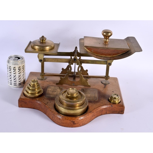 754 - A LOVELY SET OF VICTORIAN OAK AND BRASS POSTAL SCALES with original weights. 34 cm x 24 cm.