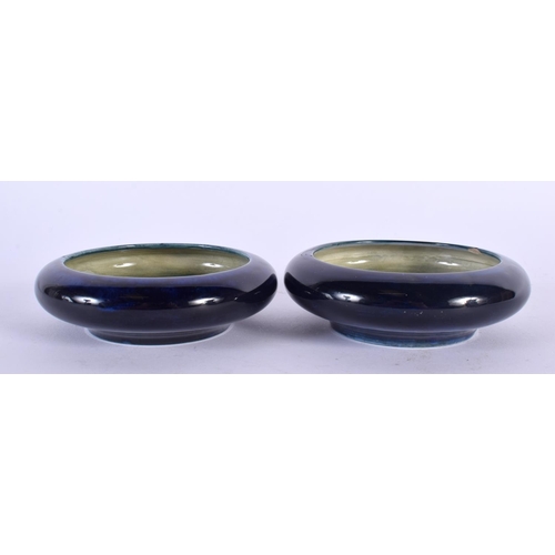 757 - A PAIR OF MOORCROFT DISHES. 10 cm diameter.