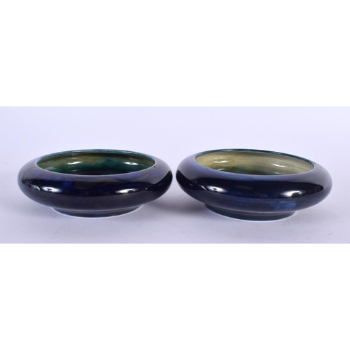 757 - A PAIR OF MOORCROFT DISHES. 10 cm diameter.