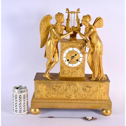 765 - A LARGE EARLY 19TH CENTURY FRENCH ORMOLU MANTEL CLOCK formed with figures beside a lyre. 42 cm x 28 ... 