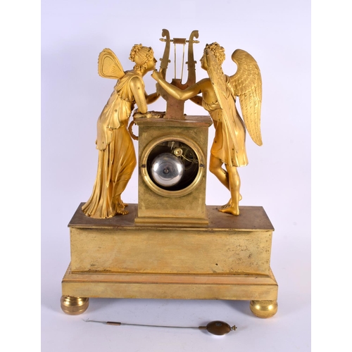 765 - A LARGE EARLY 19TH CENTURY FRENCH ORMOLU MANTEL CLOCK formed with figures beside a lyre. 42 cm x 28 ... 