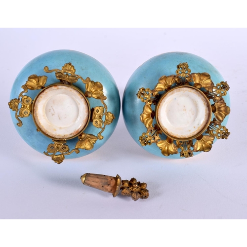 768 - A PAIR OF 19TH CENTURY ENGLISH PORCELAIN VASES with gilt metal mounts. 15 cm x 8 cm.