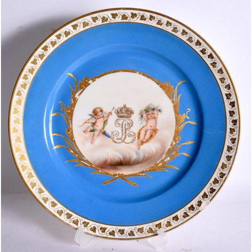 77 - AN EARLY 20TH CENTURY FRENCH PARIS PORCELAIN SEVRES STYLE PLATE painted with putti and a monogram. 2... 