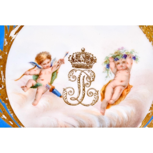 77 - AN EARLY 20TH CENTURY FRENCH PARIS PORCELAIN SEVRES STYLE PLATE painted with putti and a monogram. 2... 