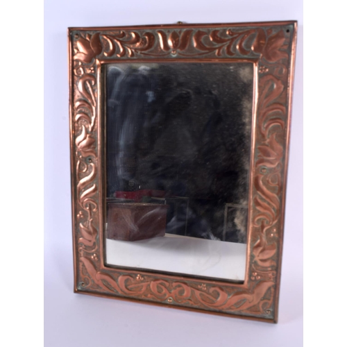 777 - AN ARTS AND CRAFTS KESWICK COPPER MIRROR together with a box and cup. Largest 28 cm x 24 cm. (3)