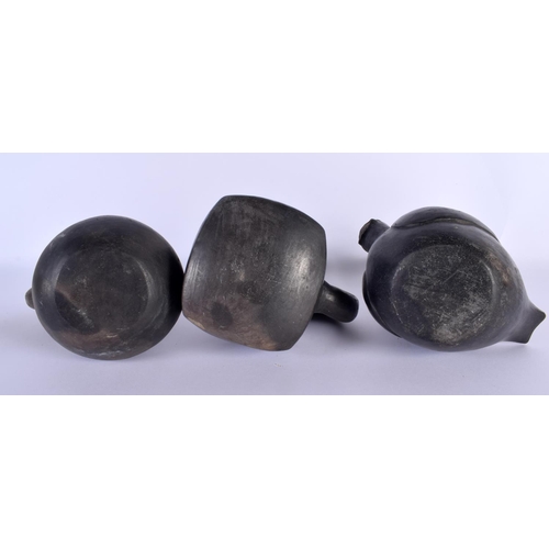 778 - THREE SOUTH AMERICAN BLACK POTTERY VESSELS. Largest 24 cm x 14 cm. (3)