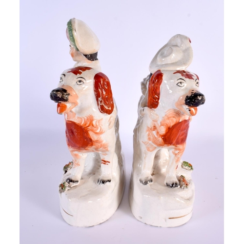 790 - A LARGE PAIR OF 19TH CENTURY STAFFORDSHIRE FIGURS modelled as children riding upon dogs. 24 cm x 16 ... 