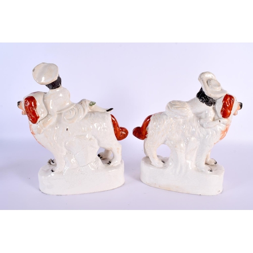 790 - A LARGE PAIR OF 19TH CENTURY STAFFORDSHIRE FIGURS modelled as children riding upon dogs. 24 cm x 16 ... 