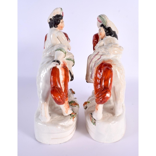 790 - A LARGE PAIR OF 19TH CENTURY STAFFORDSHIRE FIGURS modelled as children riding upon dogs. 24 cm x 16 ... 