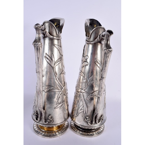 792 - A RARE LARGE PAIR OF ELKINGTONS AESTHETIC MOVEMENT SILVER PLATED JUGS decorated all over with birds ... 