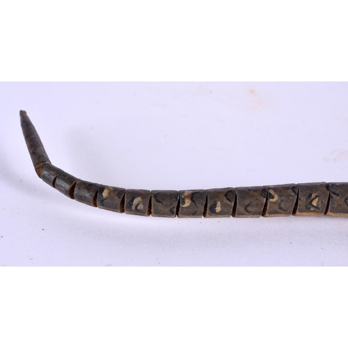 817 - AN UNUSUAL EARLY 20TH CENTURY CONTINENTAL FOLK ART CARVED WOOD SNAKE of articulated form. 80 cm long... 