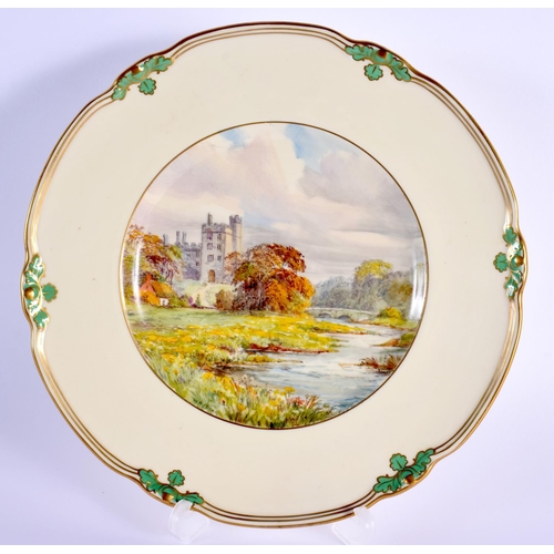 82 - Royal Crown Derby plate painted by W. E. J. Dean, signed,  with a river landscape of Haddon Hall, na... 