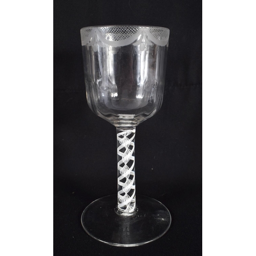 834 - AN ANTIQUE WINE GLASS. 16 cm high.