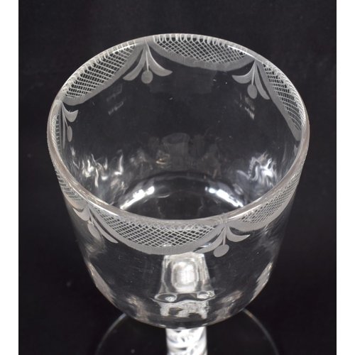 834 - AN ANTIQUE WINE GLASS. 16 cm high.