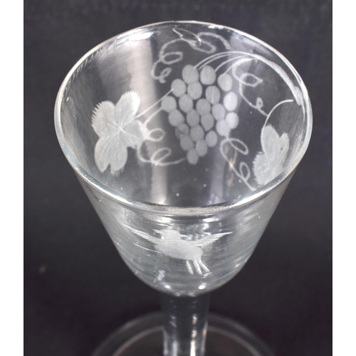 835 - AN ANTIQUE WINE GLASS. 15 cm high.