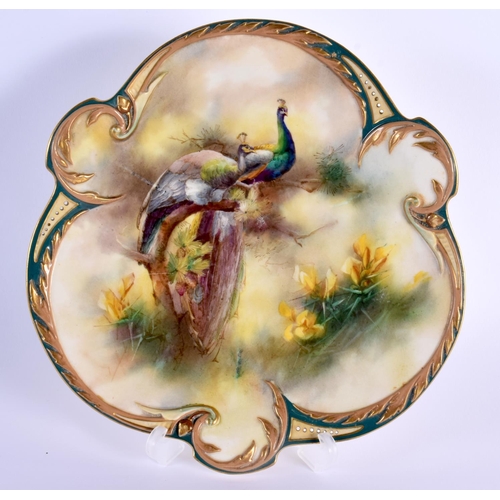 84 - Early 20th c. Hadley Worcester shaped plate painted with two peacocks in landscape 22cm Diameter