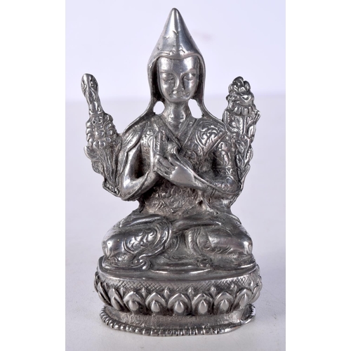 1015 - A CHINESE TIBETAN WHITE METAL FIGURE OF A BUDDHA. 153 grams. 8 cm x 4.75 cm.