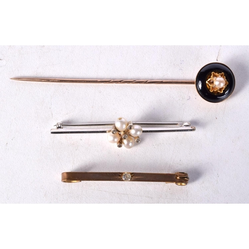 1223 - TWO ANTIQUE BAR BROOCHES together with an enamelled seed pearl tie pin. 8 grams. Largest 8 cm x 1.5 ... 