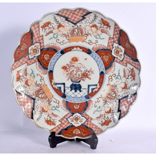 2432 - THREE 19TH CENTURY JAPANESE MEIJI PERIOD IMARI PLATES painted with landscapes. 30 cm wide. (3)