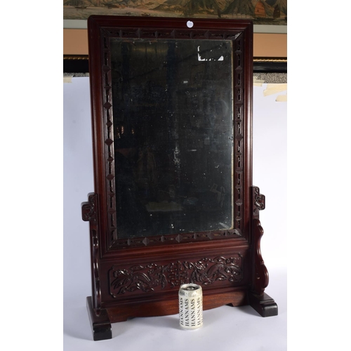 2442 - A LARGE 19TH CENTURY CHINESE CARVED HARDWOOD MIRROR ON STAND Qing, decorated with dragons. 80 cm x 4... 