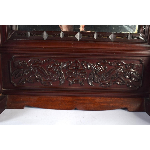 2442 - A LARGE 19TH CENTURY CHINESE CARVED HARDWOOD MIRROR ON STAND Qing, decorated with dragons. 80 cm x 4... 