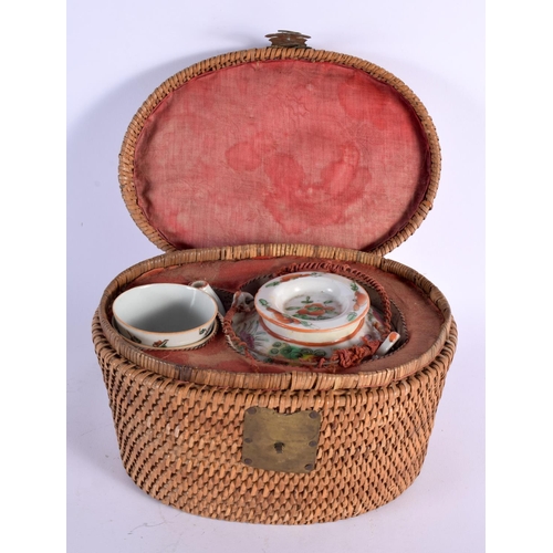 2445 - A LATE 19TH CENTURY CHINESE CANTON FAMILLE ROSE TEAPOT within original wicker case, with matching te... 