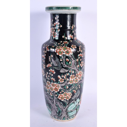 2456 - A LARGE 19TH CENTURY CHINESE FAMILLE NOIRE ROULEAU VASE bearing Kangxi marks to base. 34 cm x 12 cm.