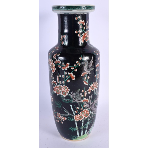 2456 - A LARGE 19TH CENTURY CHINESE FAMILLE NOIRE ROULEAU VASE bearing Kangxi marks to base. 34 cm x 12 cm.