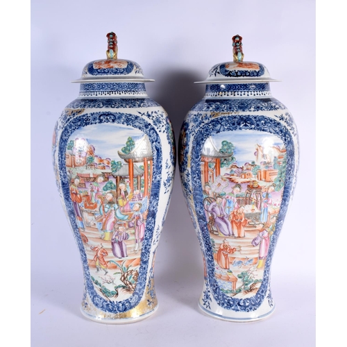 2460 - A VERY LARGE PAIR OF 18TH CENTURY CHINESE EXPORT BLUE AND WHITE VASES AND COVERS Qianlong, painted w... 