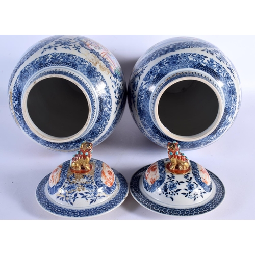 2460 - A VERY LARGE PAIR OF 18TH CENTURY CHINESE EXPORT BLUE AND WHITE VASES AND COVERS Qianlong, painted w... 