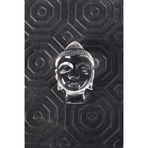 3588 - A small carved Crystal Buddhas head 3 pm.